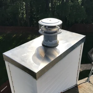 new stainless steel chimney chase cover and new stainless steel prefab chimney cap for a prefab chimney