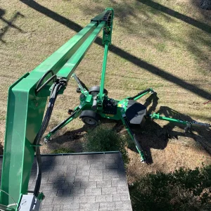 Using a bucket lift for chimney repair accessibility.