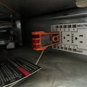 Technician checking gas fireplace power supply with tester in Chesapeake